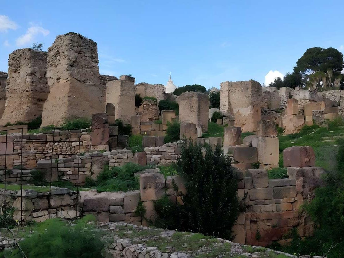 Dusk: Panoramic view of the ruins and summit of Mount Birsa