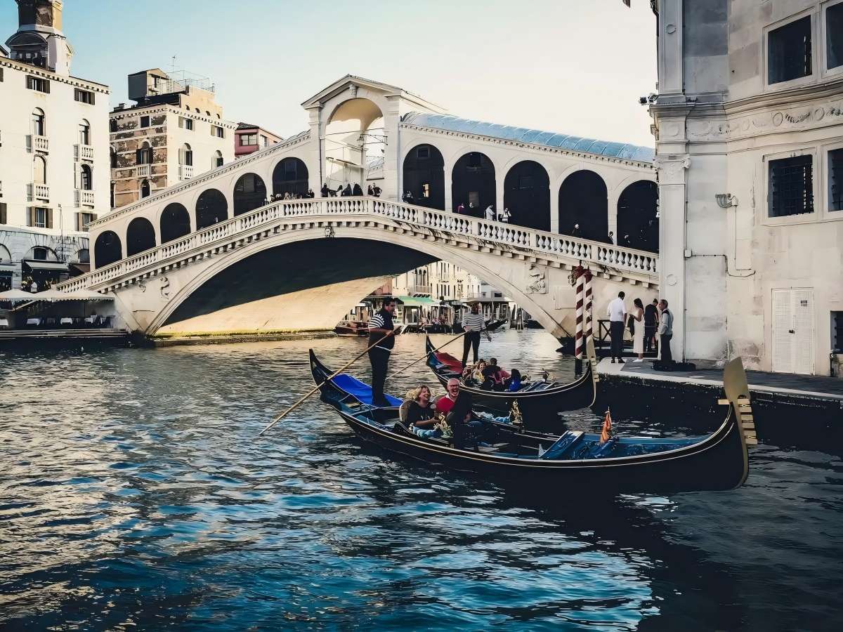Ride the water bus and see the bridge's silhouette against the shimmering waves